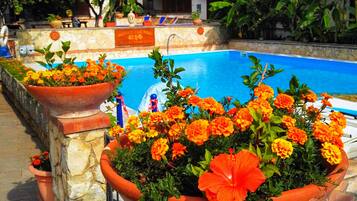 Seasonal outdoor pool, pool loungers