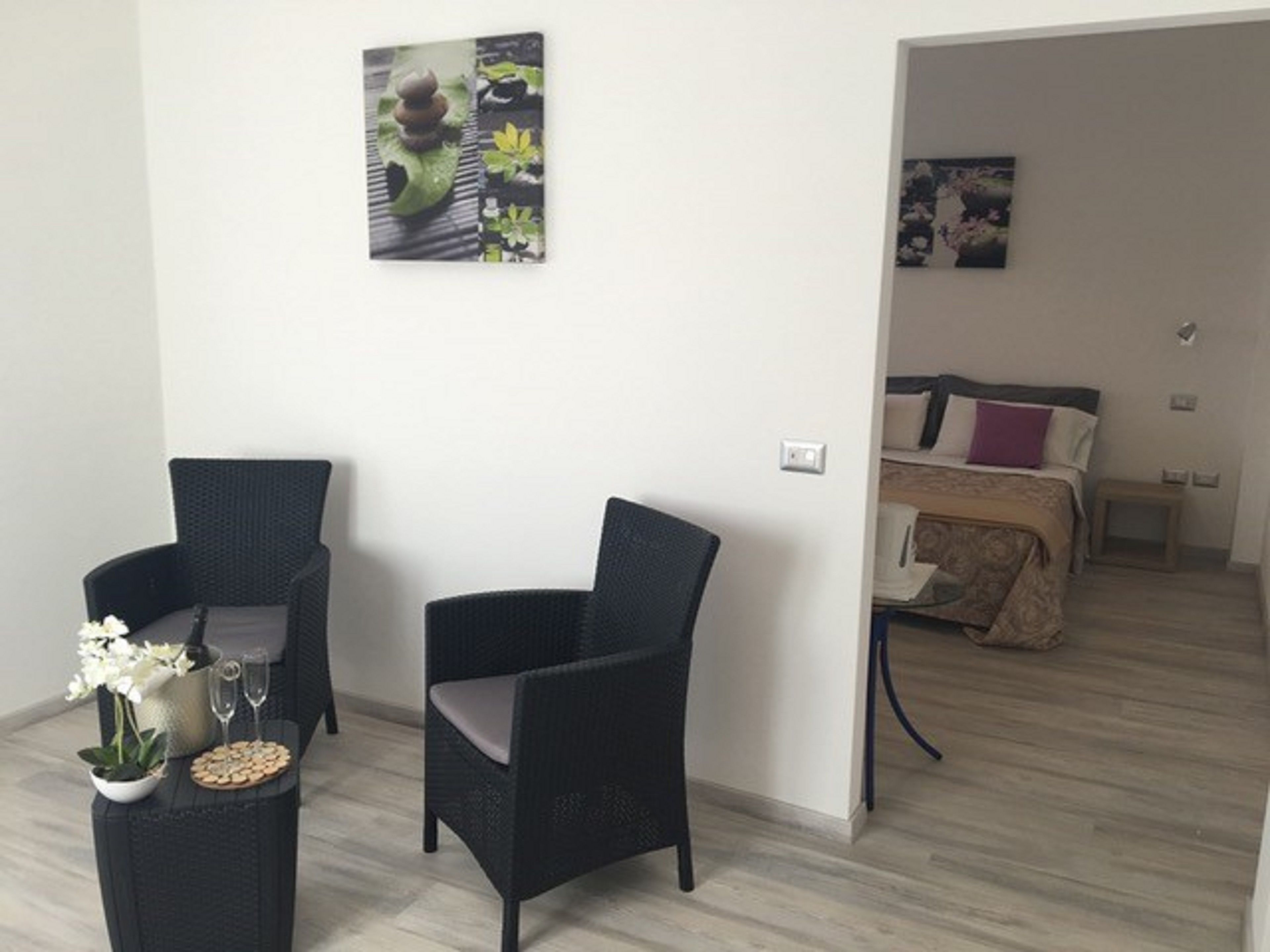 Suite familiare, balcone, vista lago | Area soggiorno