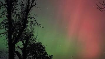 A night sky with the aurora borealis.