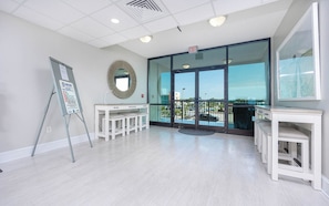 Enjoy a spacious room with a large mirror, functional workspace, and access to an outdoor area.