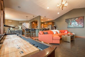 Flat-screen TV, fireplace, books