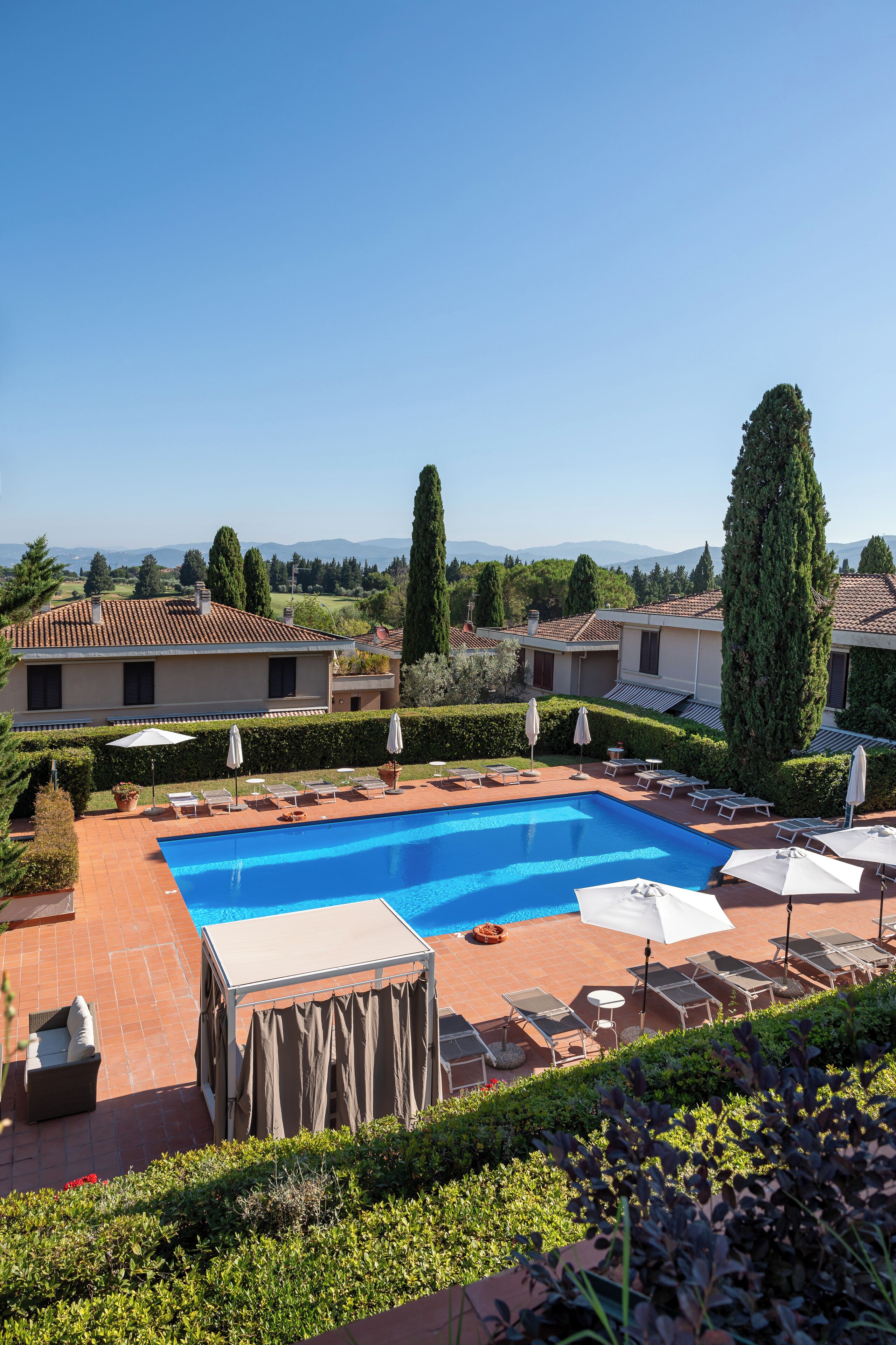 Seasonal outdoor pool, pool umbrellas, pool loungers