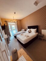 Family Room | Iron/ironing board, bed sheets