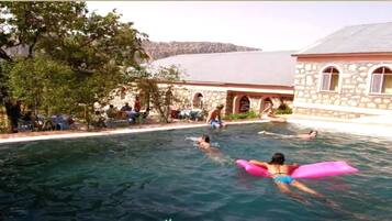 Outdoor pool, pool umbrellas, sun loungers