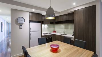Apartment, 3 Bedrooms | Private kitchen | Full-sized fridge, microwave, oven, stovetop