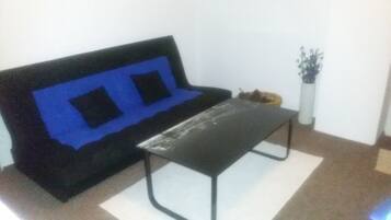 Family Suite, 3 Bedrooms, Balcony | Living area | Flat-screen TV