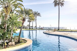 2 outdoor pools, pool umbrellas, pool loungers