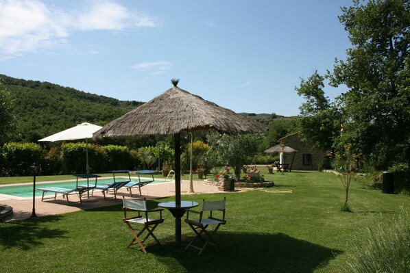 Seasonal outdoor pool, pool umbrellas, pool loungers