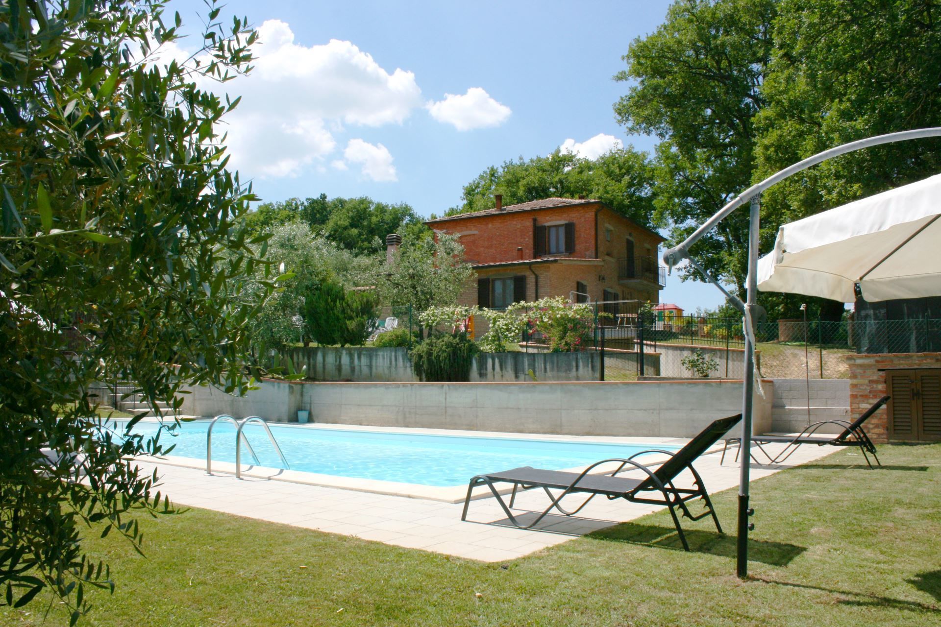 Outdoor pool, pool umbrellas, sun loungers