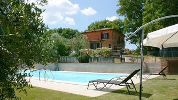 Outdoor pool, pool umbrellas, sun loungers