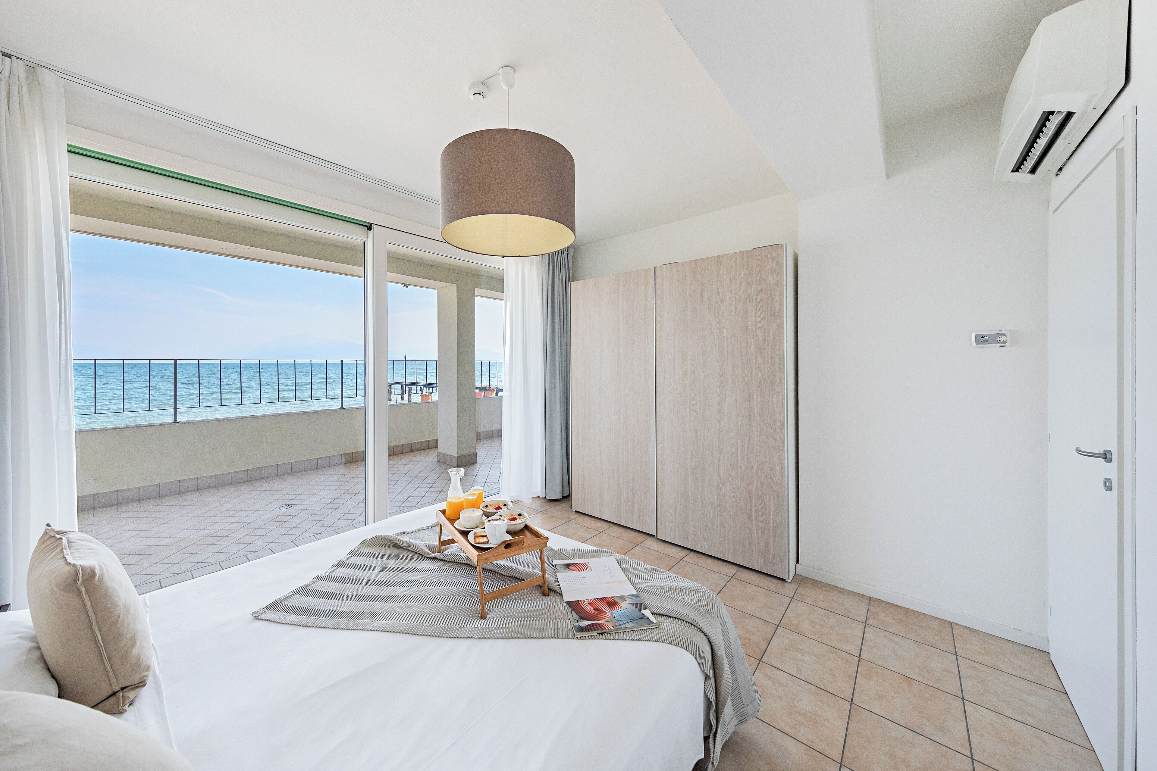 Appartamento, 2 camere da letto, vista lago | Ferro/asse da stiro, Wi-Fi gratuito, lenzuola