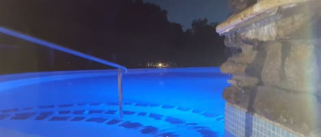 Seasonal outdoor pool, open 10:00 AM to 7:00 PM, pool umbrellas