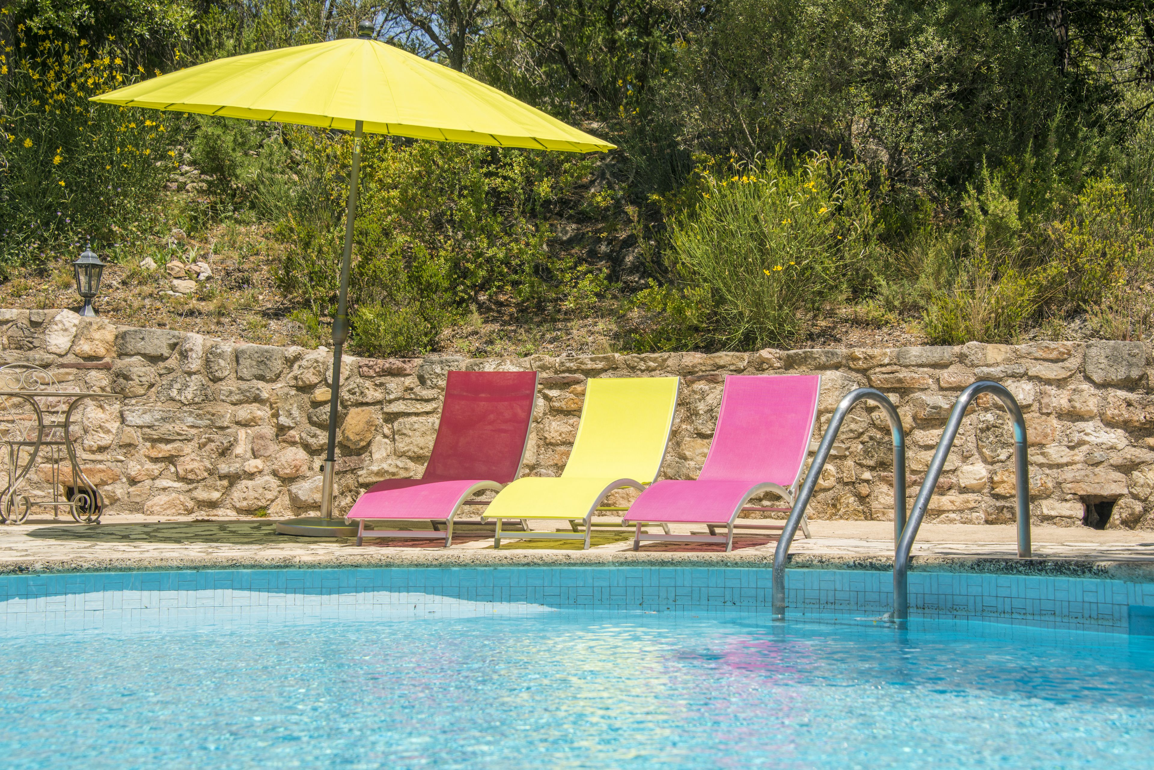 seasonal outdoor pool, open 10:00 am to 7:00 pm, pool umbrellas