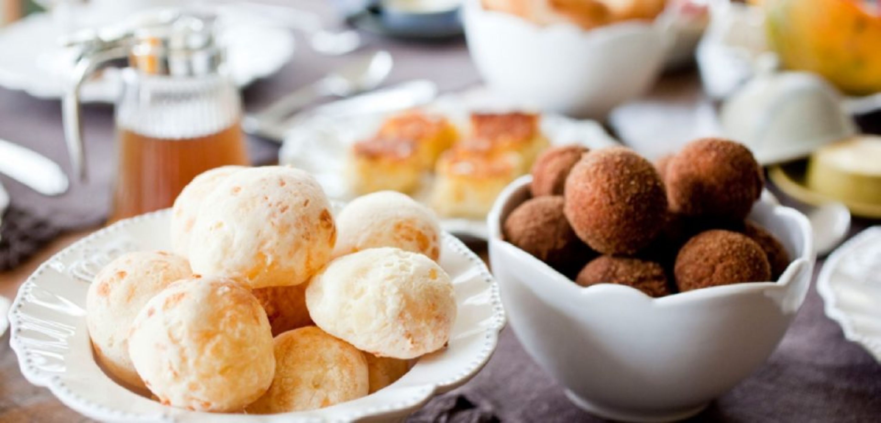 A table with various food items including bread rolls and chocolate truffles.