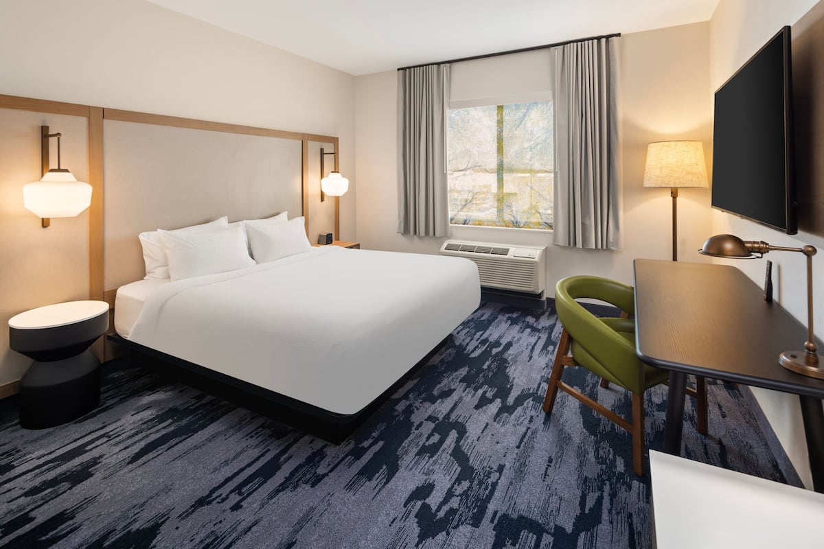 Premium bedding, desk, laptop workspace, blackout curtains