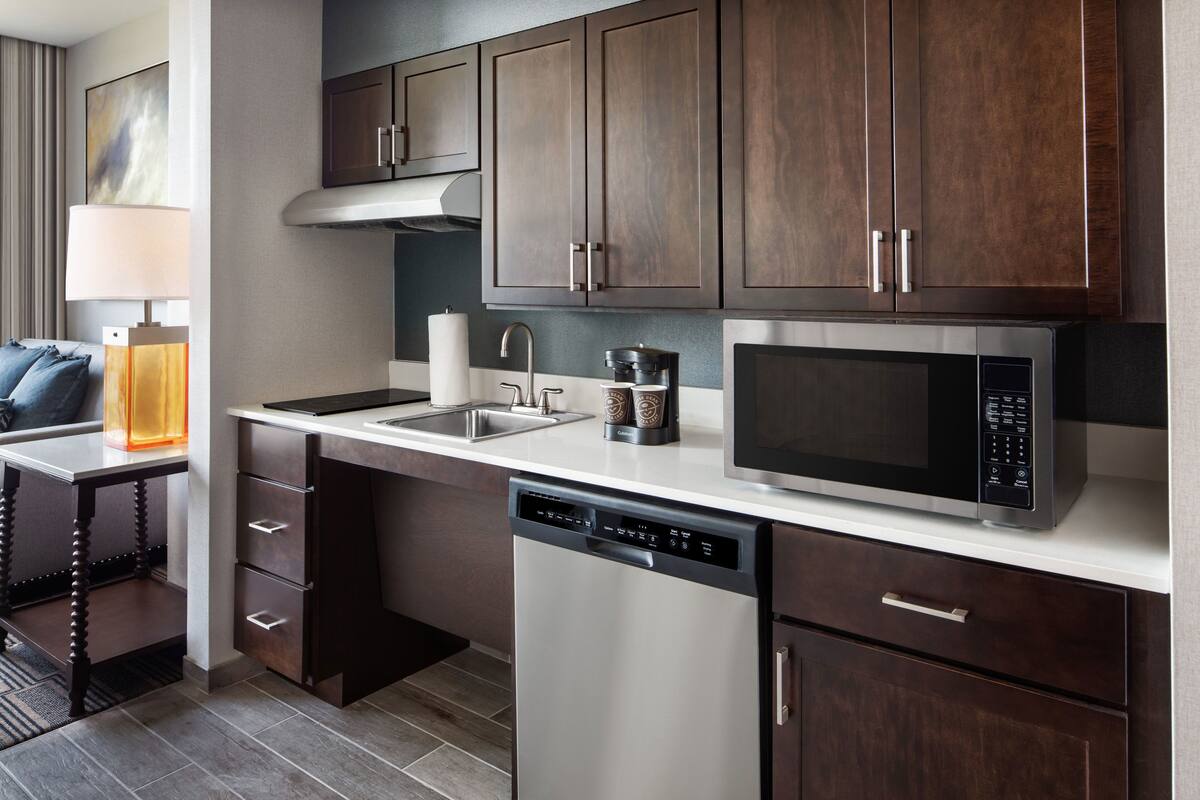 full-sized fridge, microwave, stovetop, dishwasher