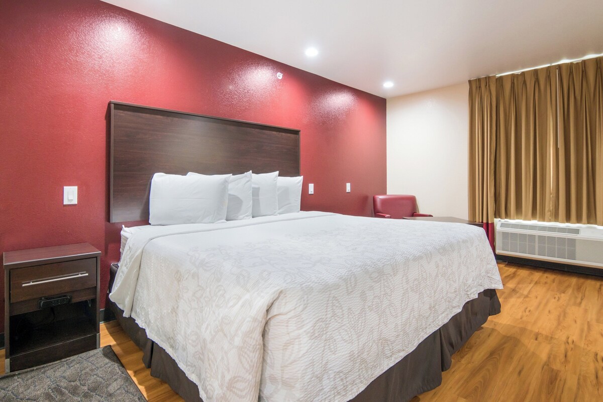 Premium bedding, desk, laptop workspace, iron/ironing board