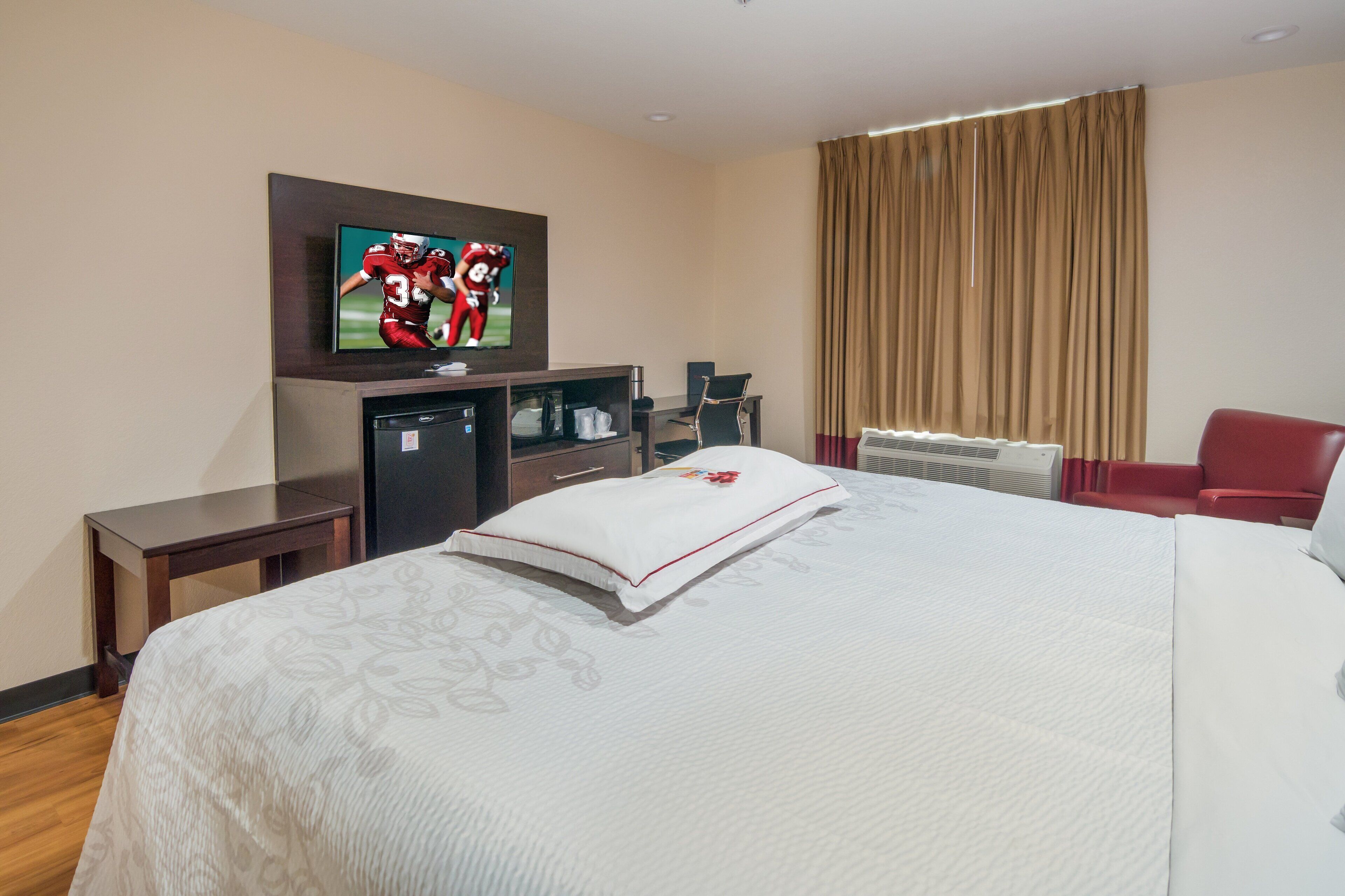 Premium bedding, desk, laptop workspace, iron/ironing board