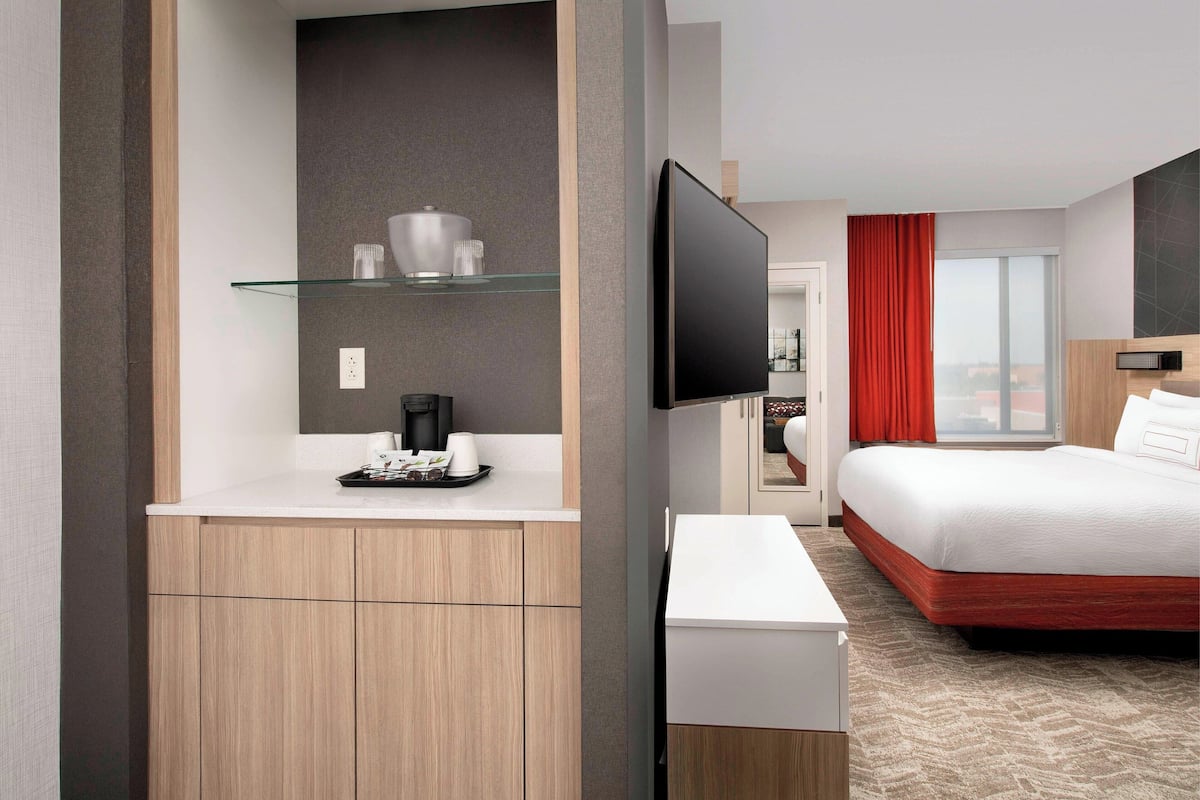 premium bedding, desk, blackout curtains, iron/ironing board