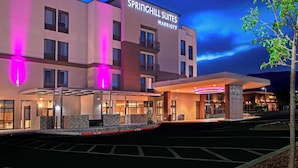 A hotel with a modern facade, a prominent signage for Springhill Suites Marriott, and a well-lit entrance area. - SpringHill Suites by Marriott Albuquerque North/Journal Center (Albuquerque)