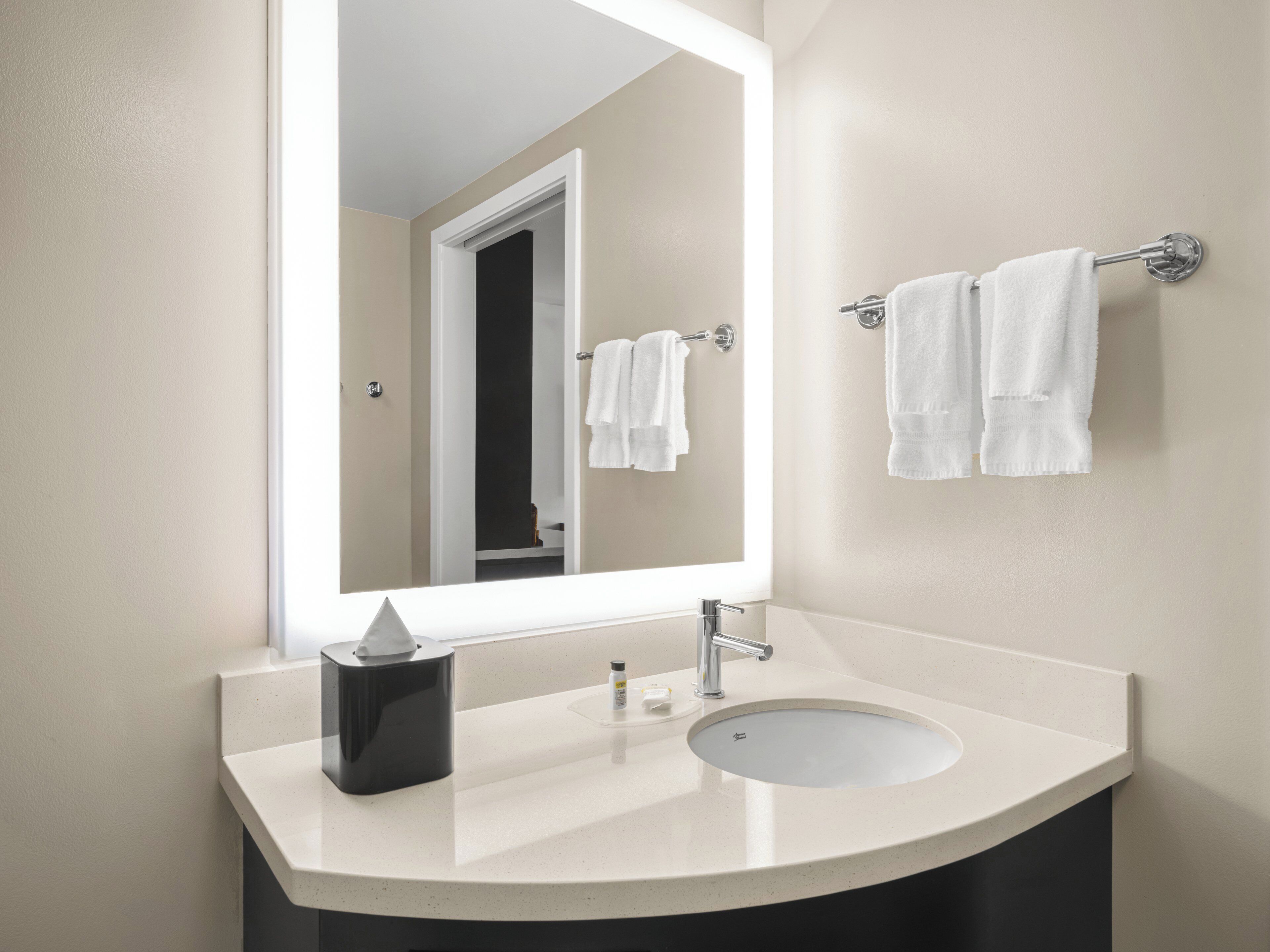 hydromassage showerhead, designer toiletries, hair dryer, towels