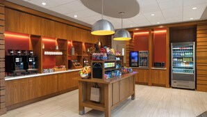 A hotel lobby with a coffee station, vending machines, and a microwave. - Staybridge Suites Seattle Downtown - Lake Union by IHG (Seattle)
