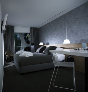 Luxe beddengoed, een kluis op de kamer, een strijkplank/strijkijzer