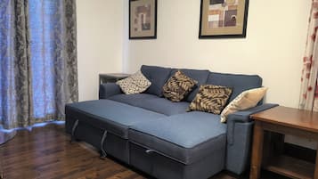 Suite 3- 1 King Bed with Sofa bed, Balcony | Living area | 32-inch LED TV with satellite channels, TV, Netflix