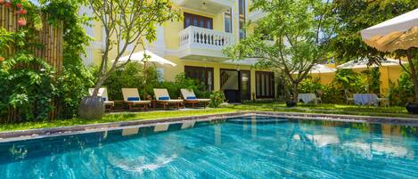 Outdoor pool, pool umbrellas, pool loungers