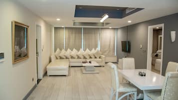 Business Suite, 1 Bedroom | Living area | Flat-screen TV