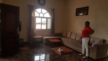 Apartment, 2 Bedrooms | Living area | Flat-screen TV