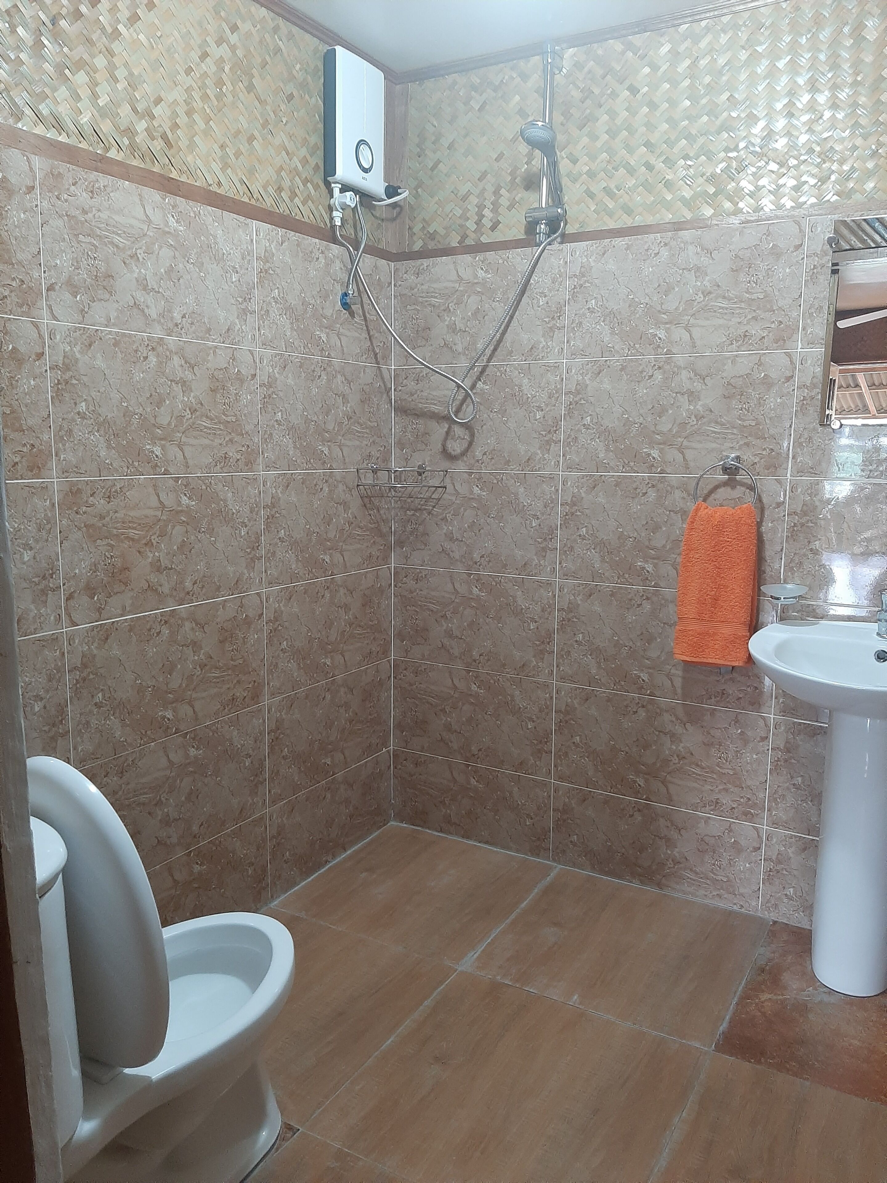 terracotta room private bathroom | bathroom | shower, hair dryer, bidet, towels
