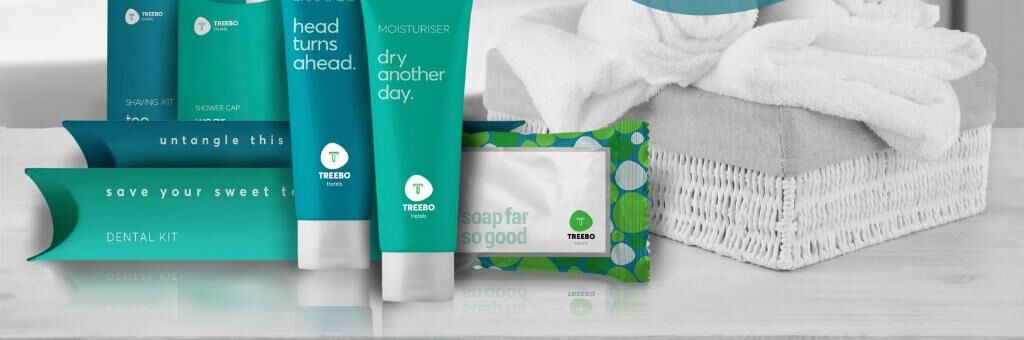 A variety of toiletries including a shaving kit, a dental kit, a hairdryer, and a bar of soap.