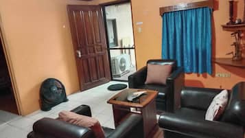 Quarto família | Área de estar | TV de tela plana