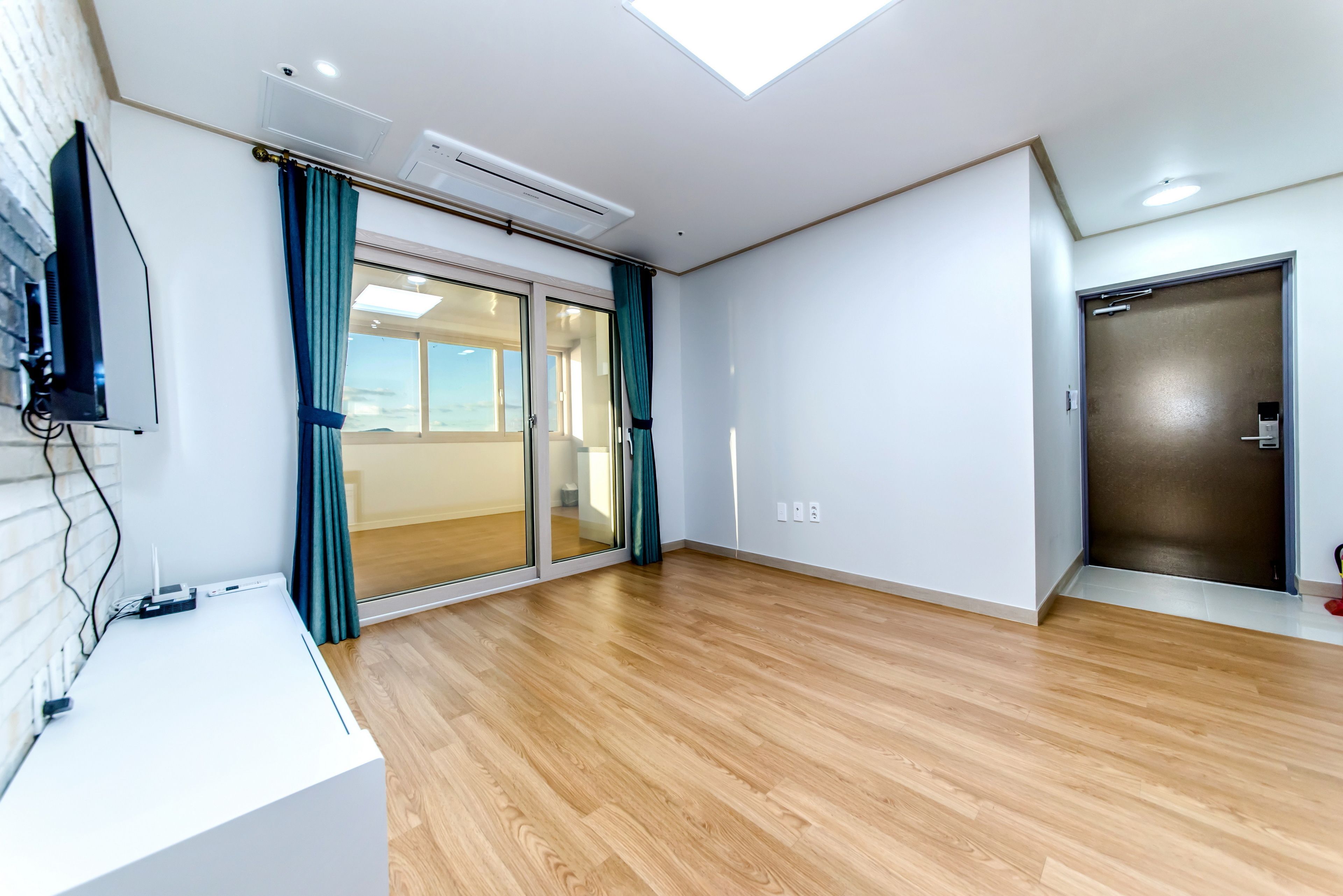 family room, ocean view | living room | flat-screen tv