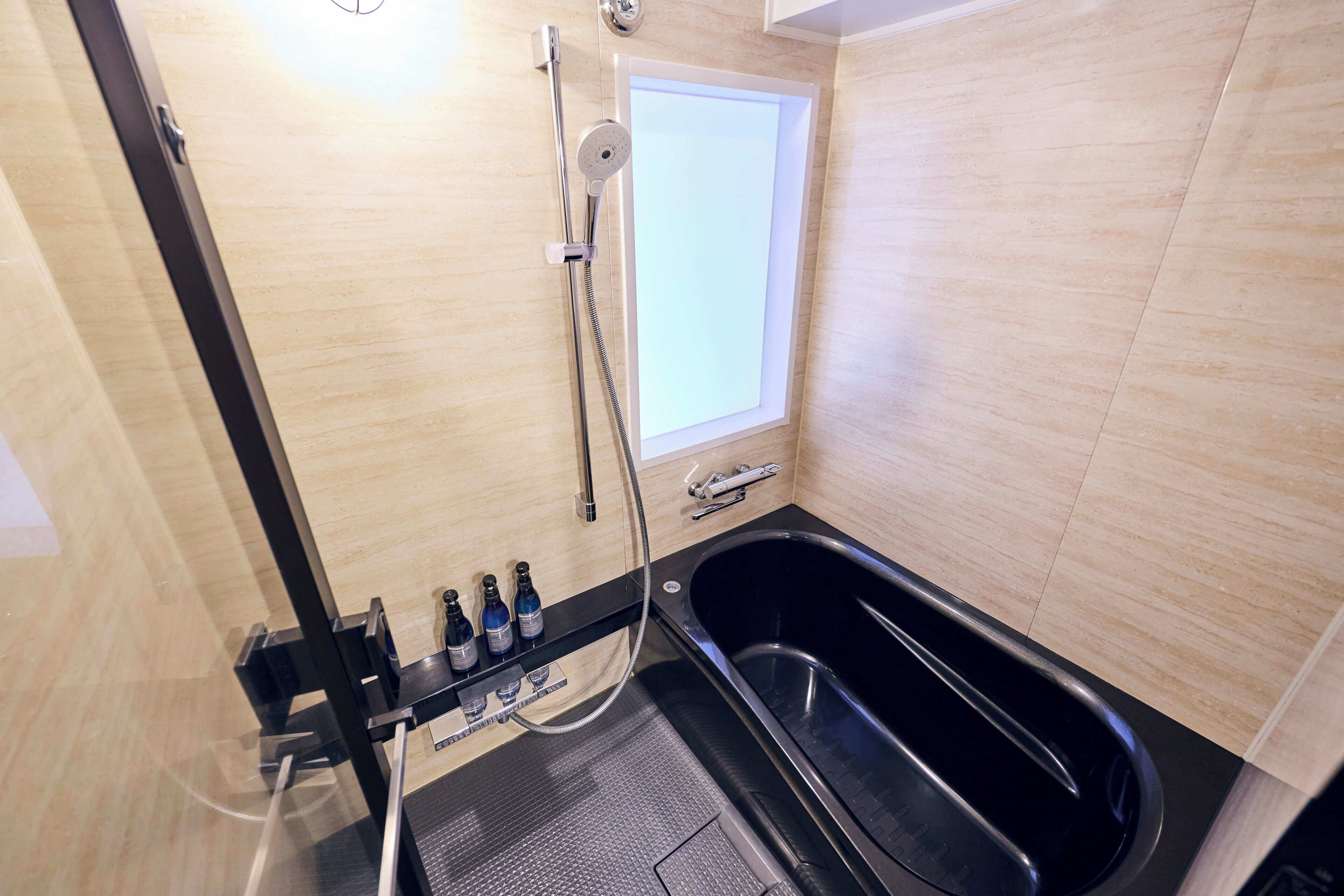 Junior Suite, Non Smoking | Bathroom | Separate tub and shower, deep soaking tub, hair dryer, slippers