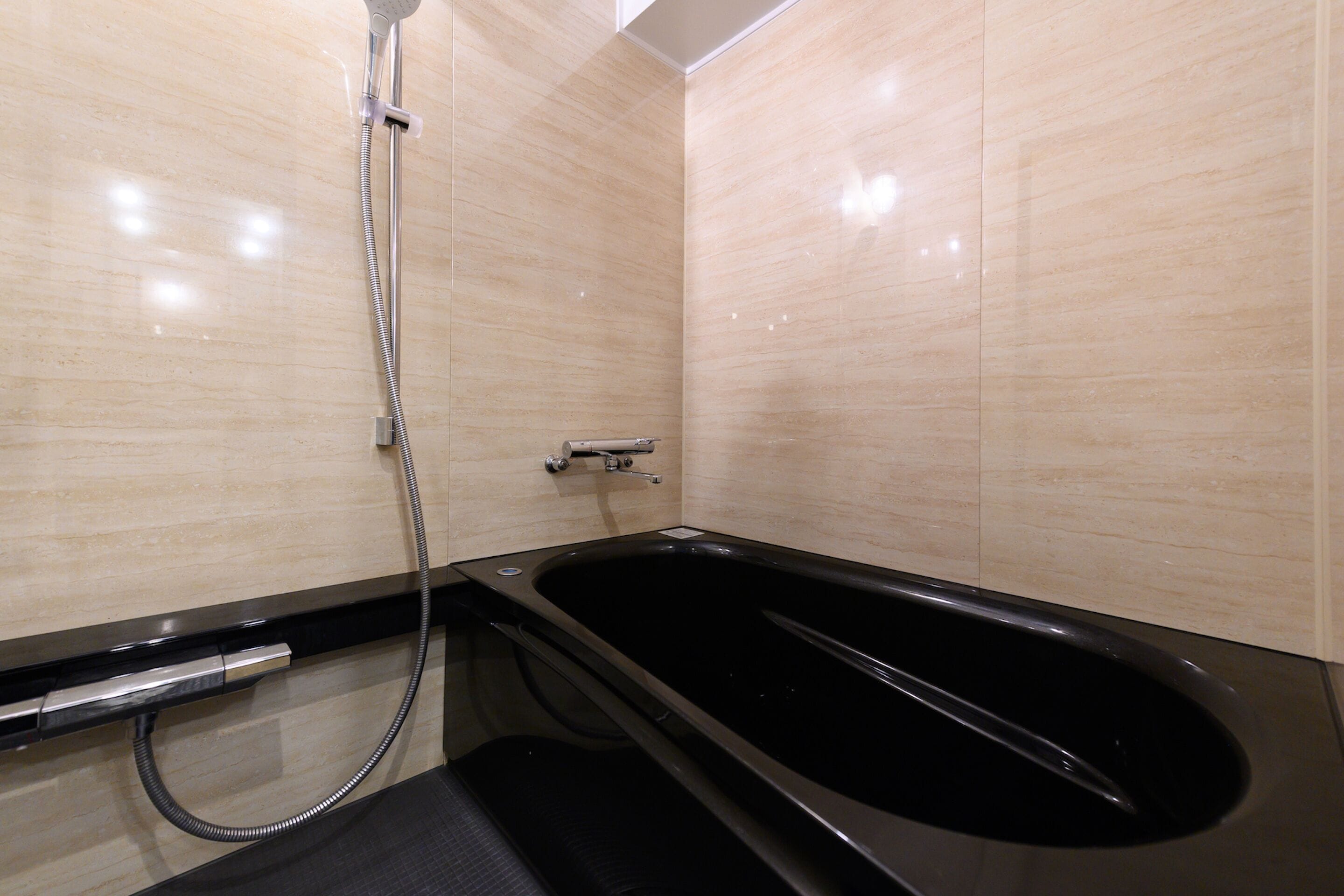 separate bathtub and shower, deep-soaking bathtub, hair dryer, slippers