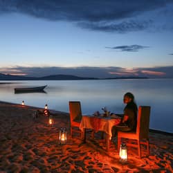 On the beach, white sand, beach towels, beach massages