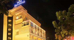 A multi-story hotel with a prominent sign reading "HOTEL PALACIO." - Hotel Palacio (Guwahati)