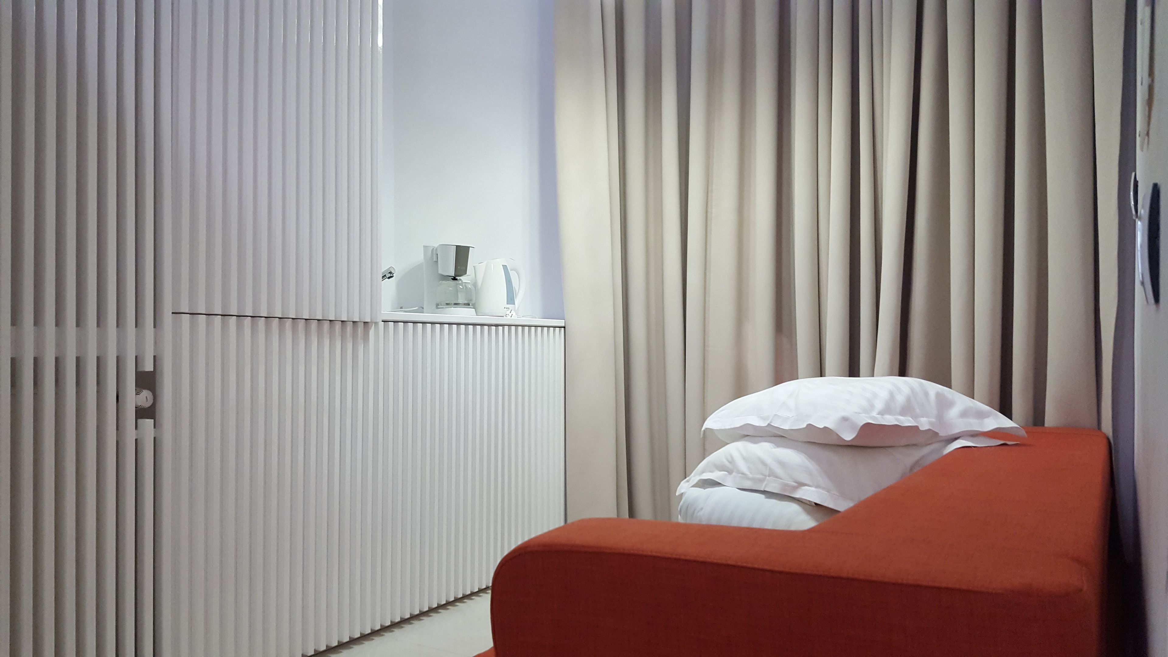 Deluxe Studio, 1 Bedroom, Beach View, Beachside | Living area | Flat-screen TV