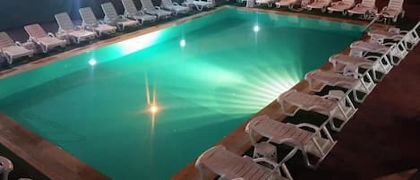 Outdoor pool, open 9 AM to 6 PM, pool umbrellas, pool loungers