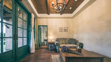 Deluxe Double Room, 1 King Bed | Living room | 42-inch LCD TV with cable channels, TV, DVD player