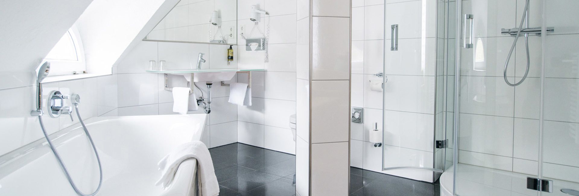 deep-soaking bathtub, hair dryer, towels