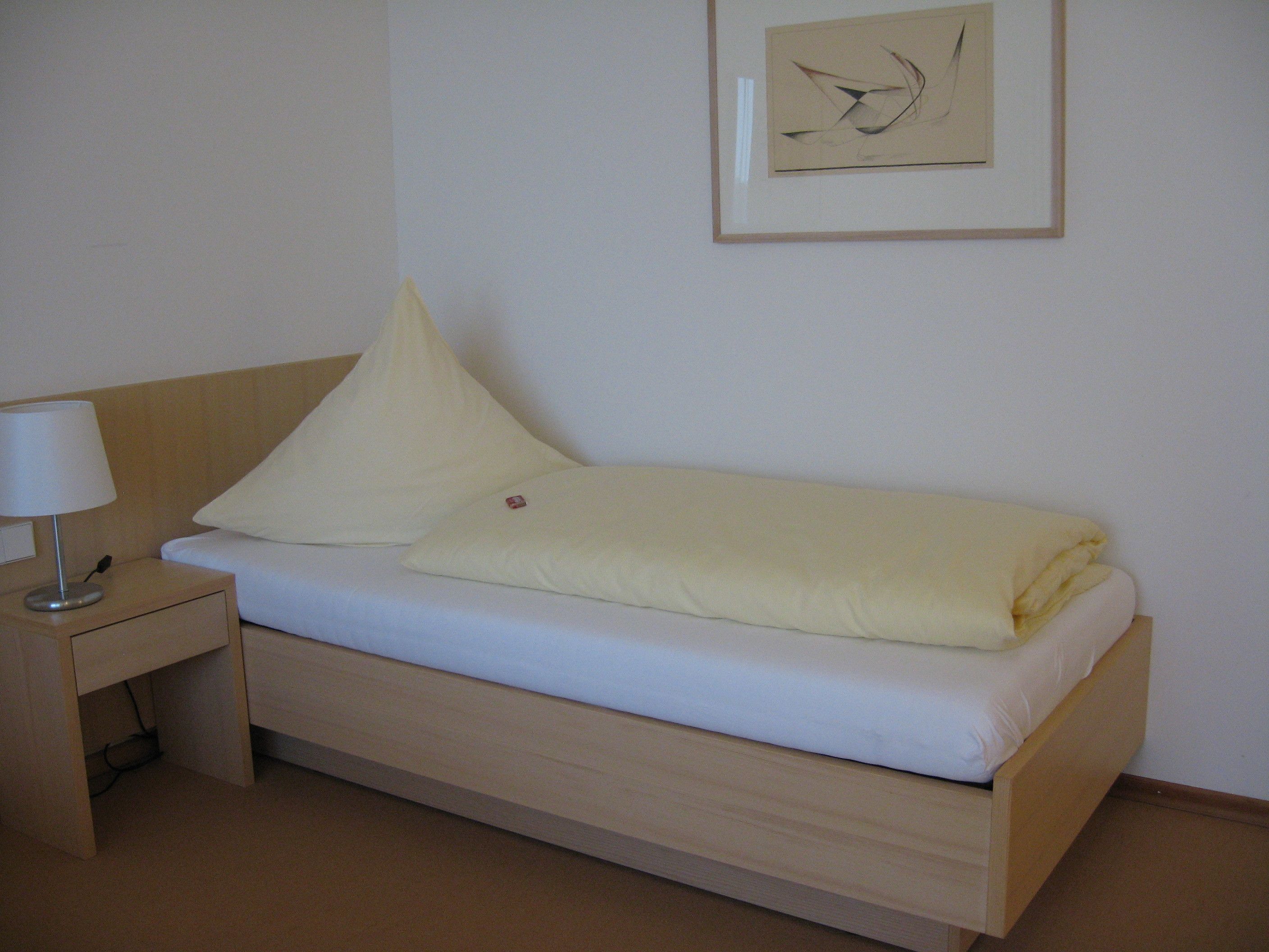 comfort single room | premium bedding, in-room safe, desk, blackout curtains