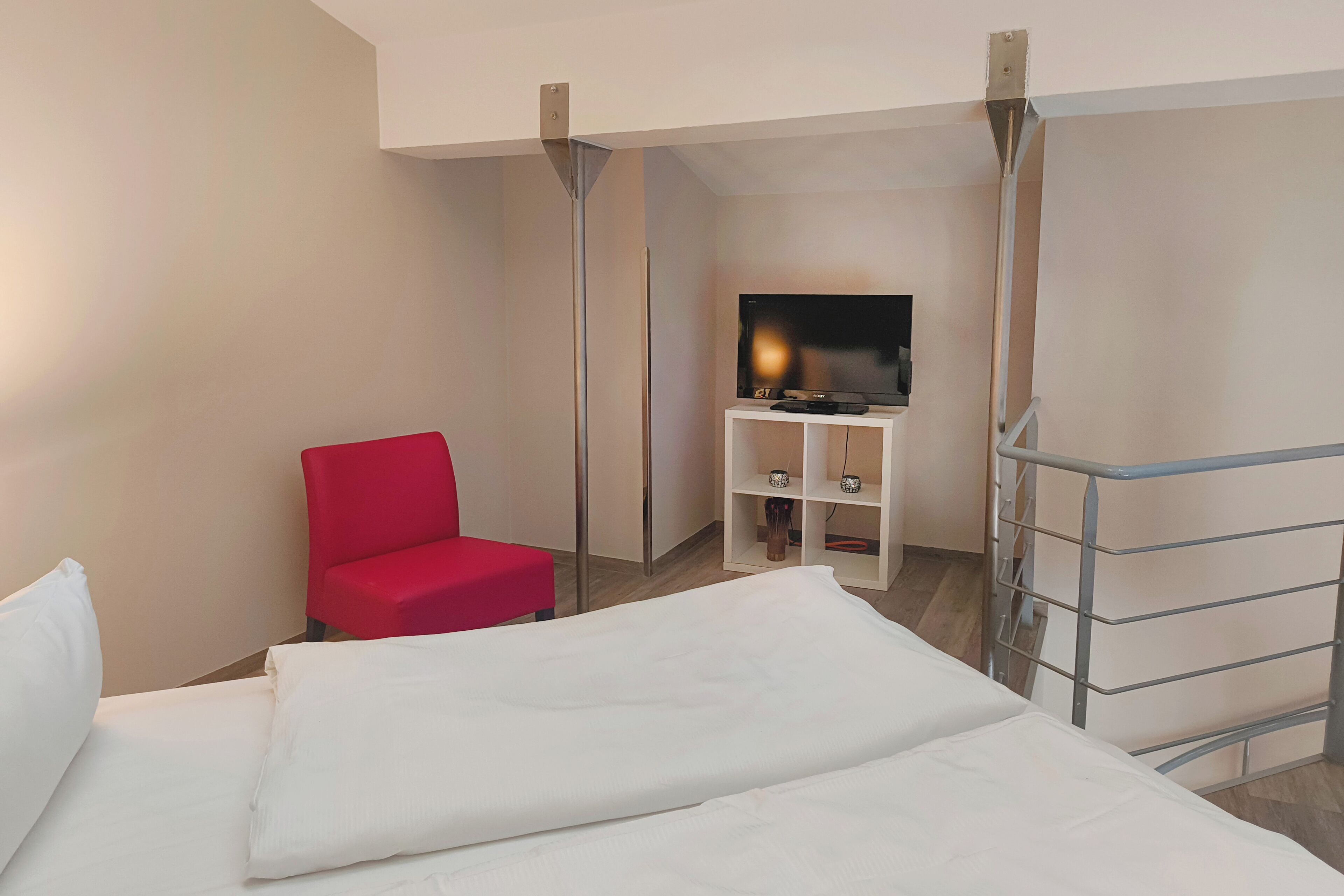 Loft, 1 Bedroom (Living Area) | Hypo-allergenic bedding, in-room safe, desk, soundproofing