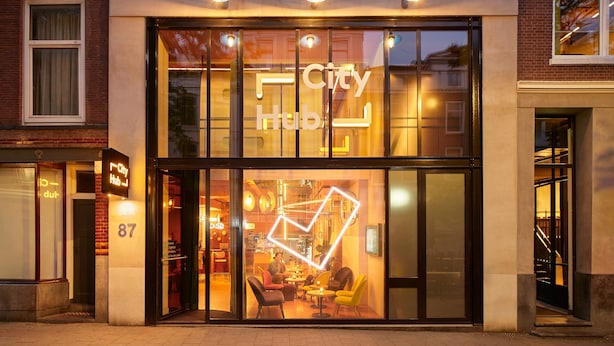 A modern building with a large glass facade, the name "City Hub" prominently displayed. - CityHub Rotterdam (Rotterdam)