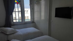 Twin Room | Blackout drapes, free cribs/infant beds, rollaway beds, free WiFi - Hotel Lutece (Rabat)