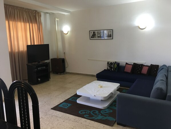 Basic Apartment, 2 Bedrooms | Living room | 40-inch flat-screen TV with satellite channels, TV