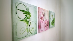A wall with three framed artworks. - Guesthouse Ivac Inn Zagreb Airport (Velika Gorica)