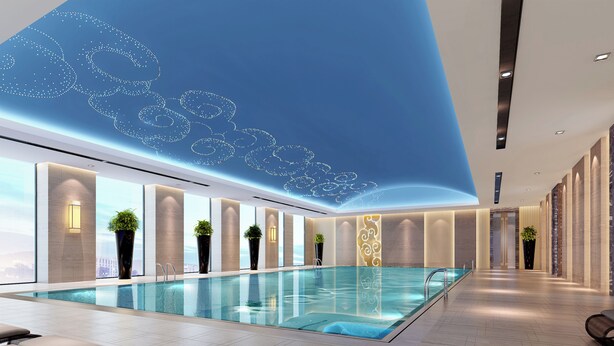 A modern indoor swimming pool with lounge areas, large windows, and decorative wall lighting. - Wanda Realm Taizhou (Taizhou)
